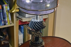 Lamp with shade made from Plymouth horn ring. Rotary switch inside old bearing with vintage Ford knob. 12V LED lighting including interior lights.