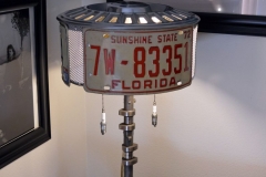 License plate lamp with vintage spark plug pulls.