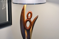 Wood and metal V8 themed lamp. Laminated from walnut, maple, sapele and teak.