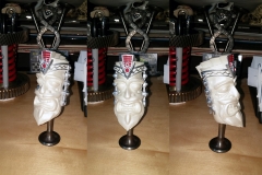 3D print of V8 tiki, painted with white pearl, silver and red insets.