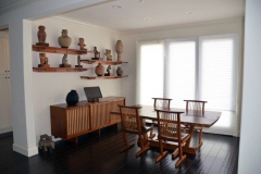 Shelves on wall built for neighbor to match his George Nakashima dining room set.