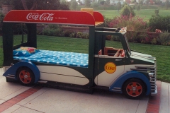 Trundle bed underneath, toy storage under hood. Doors open.