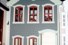 All molding details handmade, with custom turned columns. Scaled down siding.