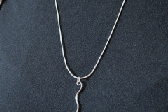 Serpentine pendant, based on cane design. 3D printed in silver.