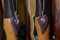 Modeled the center section in 3ds Max and had printed in silver, wood heart is purpleheart. Natural color.