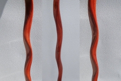 Serpentine cane in stained mahogany.